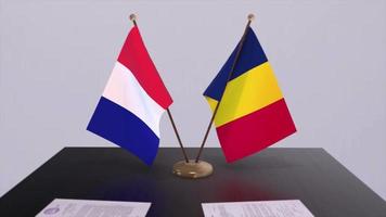 Chade e França nacional bandeiras em mesa dentro diplomático conferência sala. política acordo acordo video