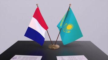 kazakhstan et France nationale drapeaux sur table dans diplomatique conférence chambre. politique traiter accord video