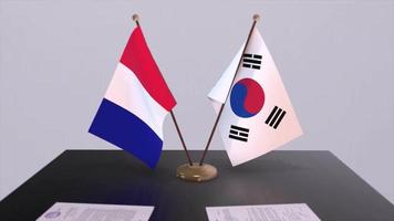 Süd Korea und Frankreich National Flaggen auf Tabelle im diplomatisch Konferenz Zimmer. Politik Deal Zustimmung video