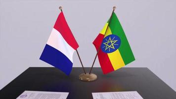 Äthiopien und Frankreich National Flaggen auf Tabelle im diplomatisch Konferenz Zimmer. Politik Deal Zustimmung video