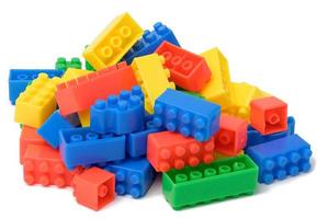 Multi-colored plastic cubes of a children's designer on a white isolated background photo