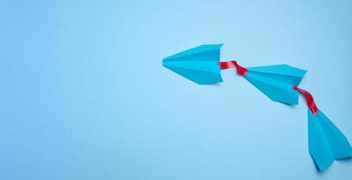 A group of blue airplanes follows each other, a concept of mass influence and manipulation photo