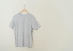 t-shirt hanging with wood hanger photo