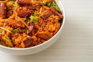 Stir-fried squid or octopus with Korean spicy sauce rice bowl photo