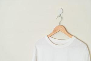 t-shirt hanging with wood hanger photo