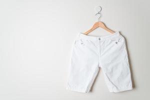 short pants hanging on wall photo