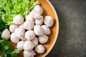 pork meatball with vegetable and spicy sauce photo