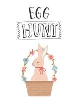 An Easter greeting card with a cute bunny sitting in a wicker basket decorated with simple flowers. The hand lettering phrase - Egg hunt. Color flat cartoon vector illustration on white background.