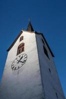 a churchtower with blue sky photo