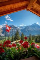 A mountain landscape photographed from a house, the window forms the frame of the image photo