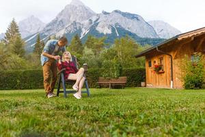 Young lovers relaxing on holiday in beautiful panorama with mountains Bavaria Germany. Couple in love relaxing in spring photo