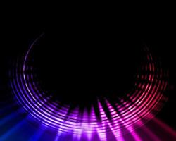 A black background with a circle with pink and blue lights. photo