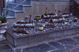 a garden of stones near the porch photo