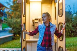 woman in retro telephone booth photo