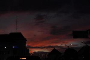 Cityscape in the evening with sunset background photo