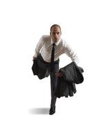 Runnning businessman on white background photo