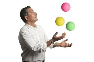 Ability concept with businessman juggling photo