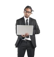 Handsome businessman with laptop photo