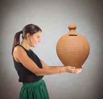 Generous woman with piggy bank photo