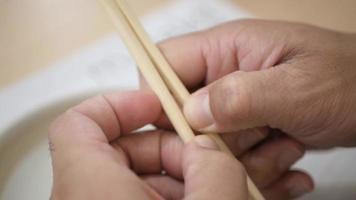hand while prepare chopstick to eat japanese food video