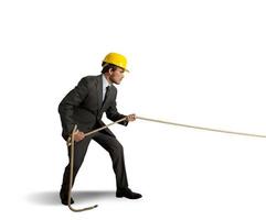 Man Pulling rope on white background photo