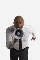 Businessman shouting on the loud speaker photo