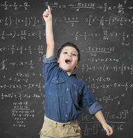 Genius child by a blackboard photo