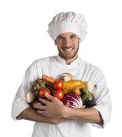 vegetariano cocinero con verduras foto