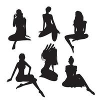 Vector graphics set of different vector black silhouettes of girls in a sitting pose