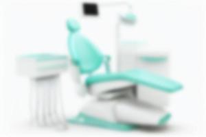 Modern dental chair in the dentist's office. Blurred background. photo