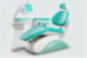 Modern dental chair in the dentist's office. Blurred background. photo