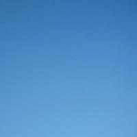 Blue sky background with tiny clouds. Abstract nature background with copy space. photo