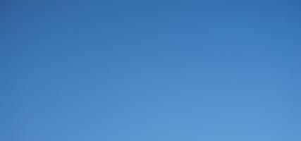 Blue sky background with tiny clouds. Abstract nature background with copy space. photo