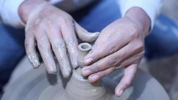 Close up view of potter making clay pot. video