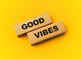 Good Vibes Text On Wooden Blocks Isolated On Yellow Background, 3d illustration photo