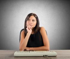 Businesswoman thinking on ther desk photo