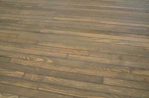 brown wood lumber or boards on floor or ground photo