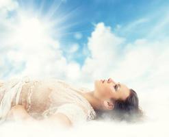 Beautiful woman with sky background photo