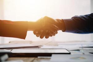 Business handshake for teamwork of business merger and acquisition,successful negotiate,hand shake,two businessman shake hand with partner to celebration partnership and business deal concept photo