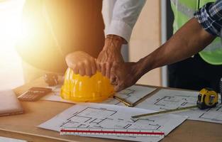 Architect concept, Architects working with blueprints in the office, Vintage Effect photo