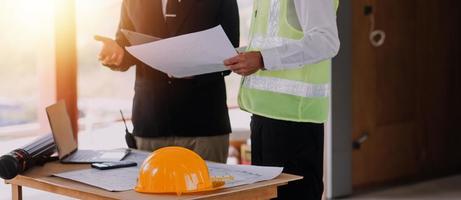 Architect concept, Architects working with blueprints in the office, Vintage Effect photo