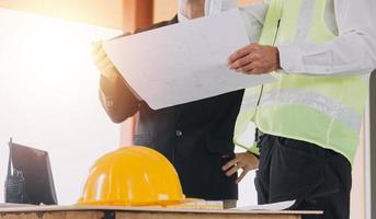 Architect concept, Architects working with blueprints in the office, Vintage Effect photo