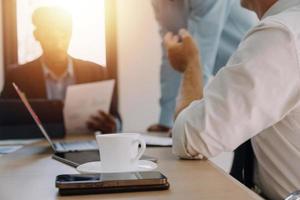 Entrepreneurs and business people conference in modern meeting room, happy multiracial coworkers have fun cooperating working together at office meeting, asian teamwork concept photo