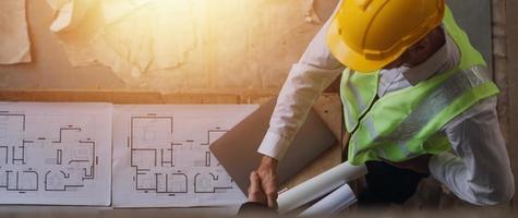 Architect concept, Architects working with blueprints in the office, Vintage Effect photo