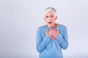 Woman having a pain in the heart area. Heart Attack. Painful Chest. Health Care, Medical Concept. High Resolution. Woman having heart attack at home photo