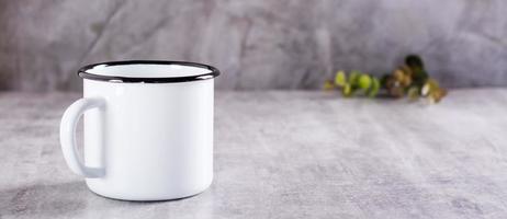 White empty metal mug on gray background for web banner photo