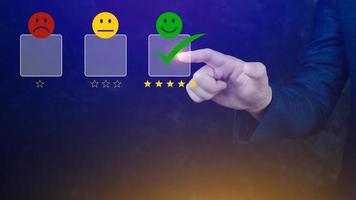 Businessman choosing happy smile face icon. feedback rating and positive customer review experience, satisfaction survey. mental health assessment. photo