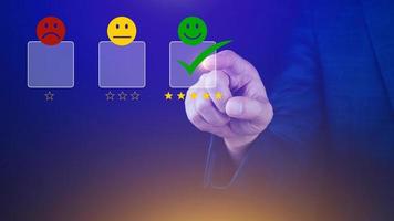 Businessman choosing happy smile face icon. feedback rating and positive customer review experience, satisfaction survey. mental health assessment. photo