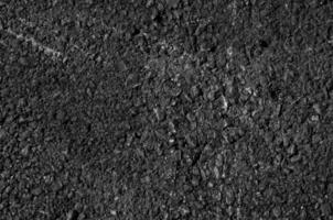 Close up of asphalt road,Black nature asphalt background,background texture of rough asphalt,macadamized texture photo