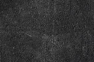 Close up of asphalt road,Black nature asphalt background,background texture of rough asphalt,macadamized texture photo